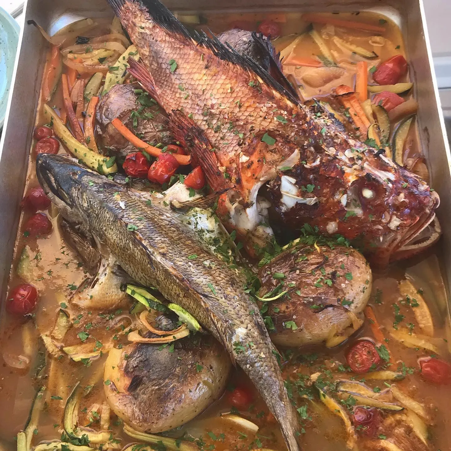Whole roast fish with vegetables